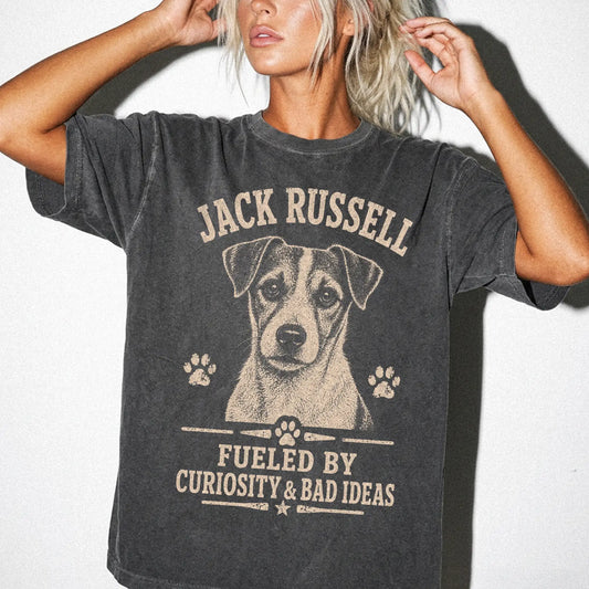 Model wearing a Pepper Comfort Colors® T-shirt featuring Jack Russell design with “Fueled By Curiosity & Bad Ideas” lettering