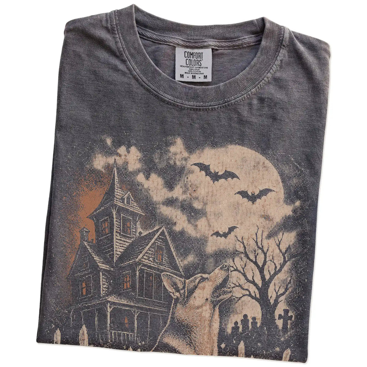 Folded Pepper Comfort Colors® T-shirt showing German Shepherd in a vintage haunted-house scene