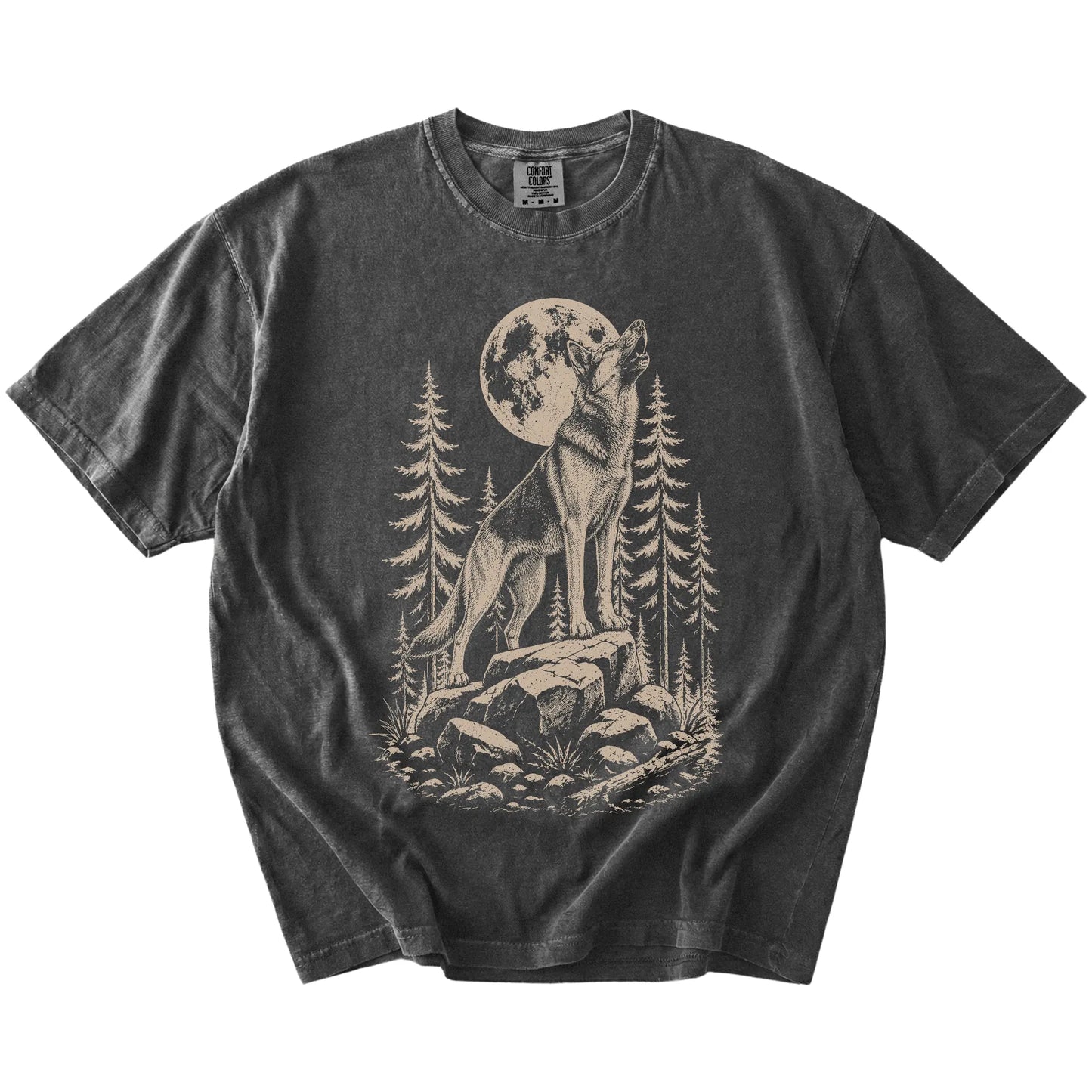 German Shepherd howling beneath the moon and pine trees on a Pepper Comfort Colors® T-shirt