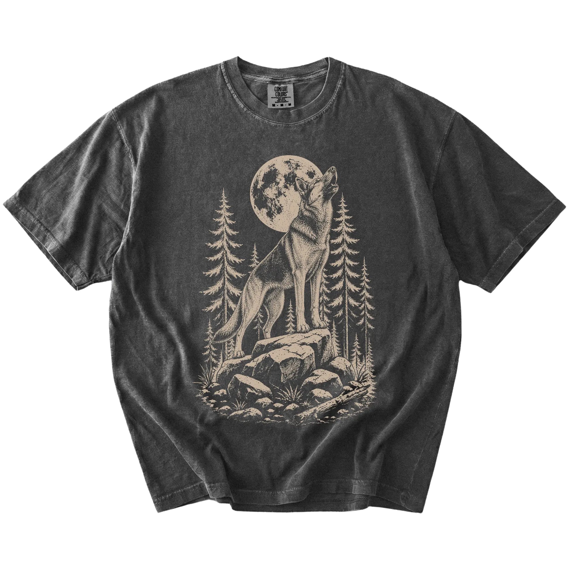 German Shepherd howling beneath the moon and pine trees on a Pepper Comfort Colors® T-shirt