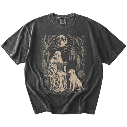 American Bulldog beside a reading ghost in a moonlit graveyard on a Pepper Comfort Colors® T-shirt