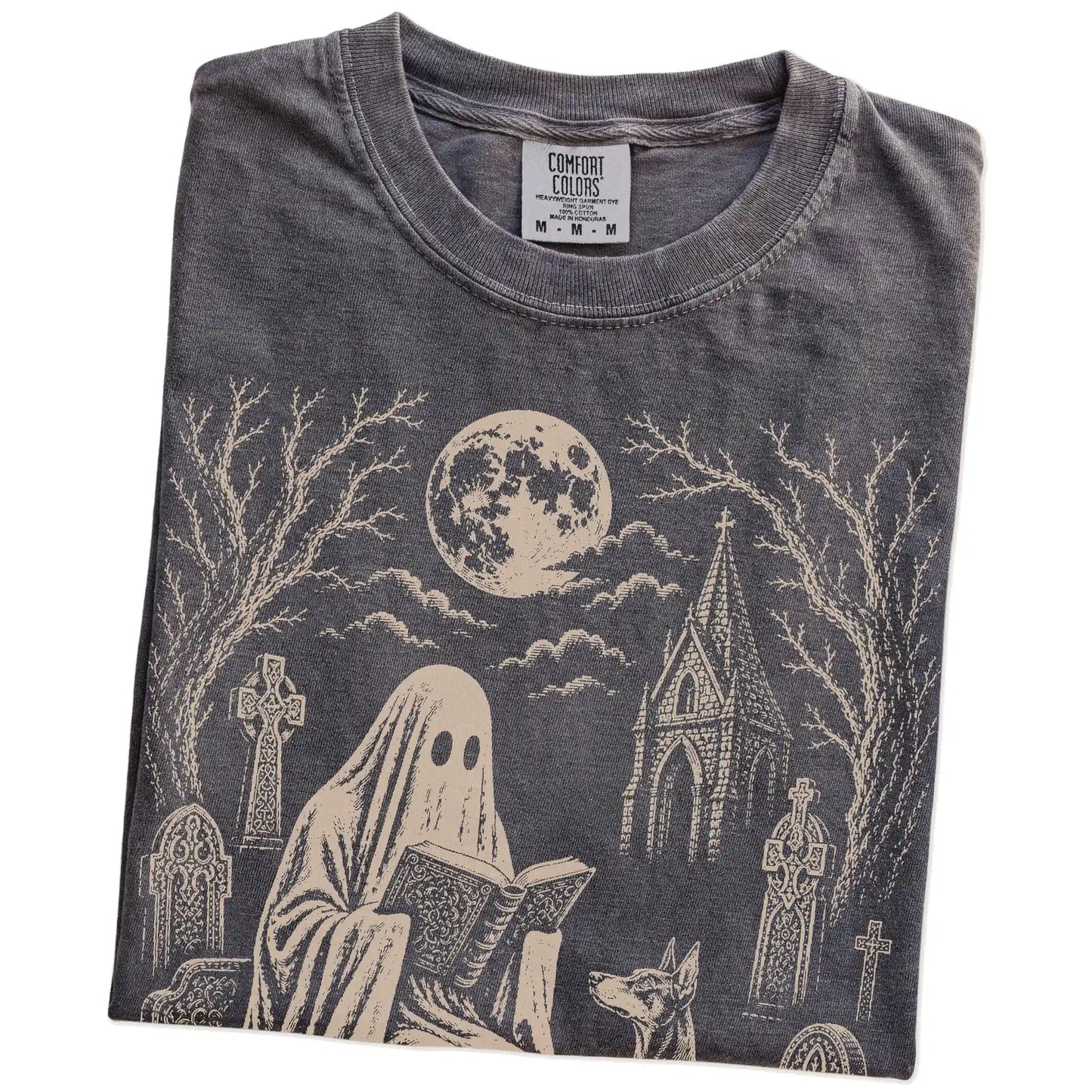 Folded Pepper Comfort Colors® T-shirt showing Doberman beside a reading ghost in a moonlit graveyard