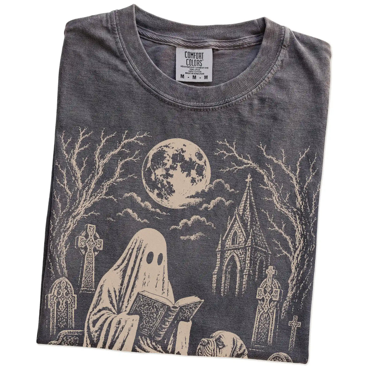 Folded Pepper Comfort Colors® T-shirt showing Mastiff beside a reading ghost in a moonlit graveyard