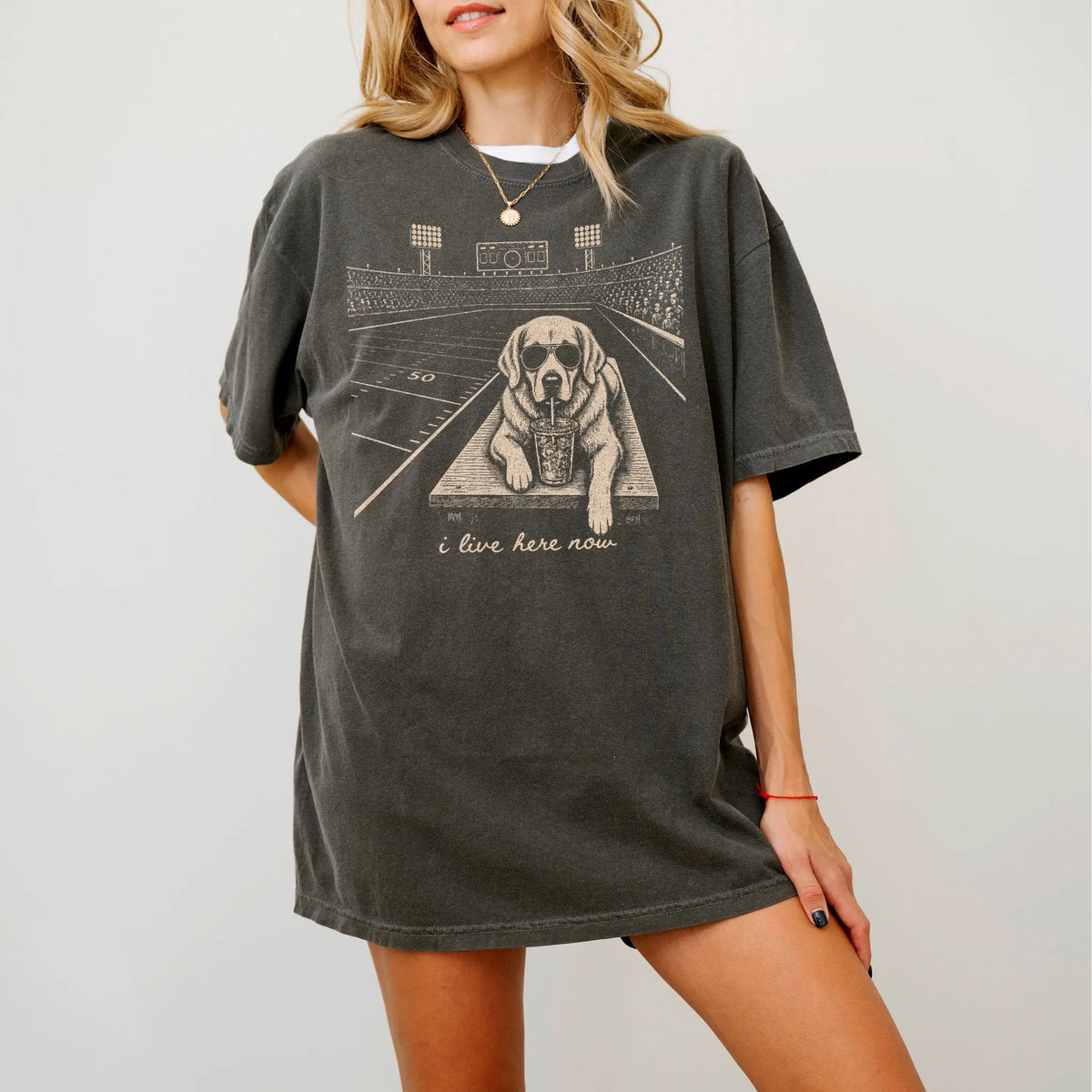 Model wearing a Pepper Comfort Colors® T-shirt featuring Golden Retriever ready for football and tailgate season