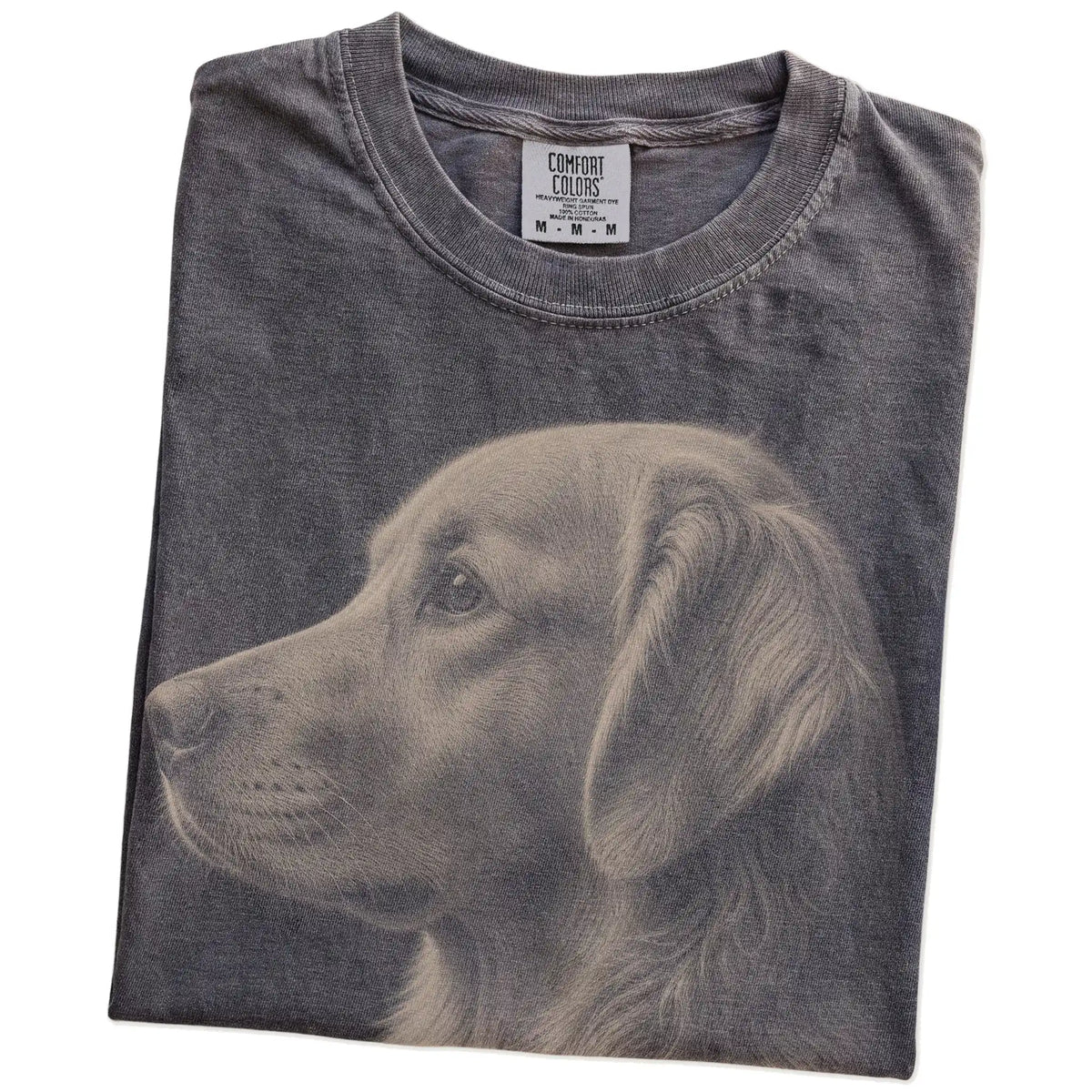 Folded Pepper Comfort Colors® T-shirt showing a detailed photographic portrait of a Golden Retriever