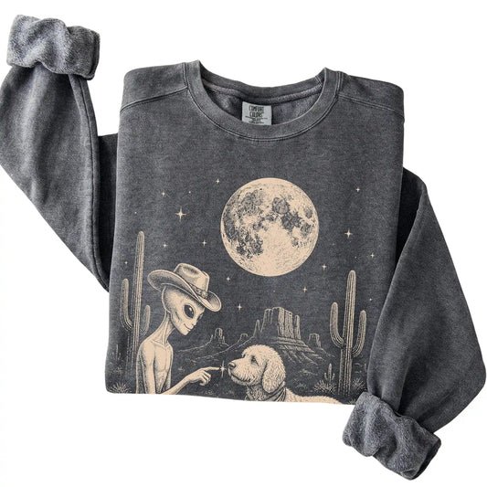 Pepper Comfort Colors® sweatshirt featuring Goldendoodle Cowboy and Alien, folded presentation