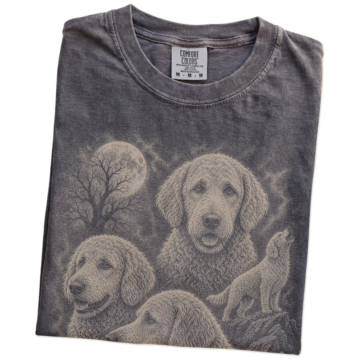 Folded Pepper Comfort Colors® T-shirt showing a vintage moon montage featuring Goldendoodle