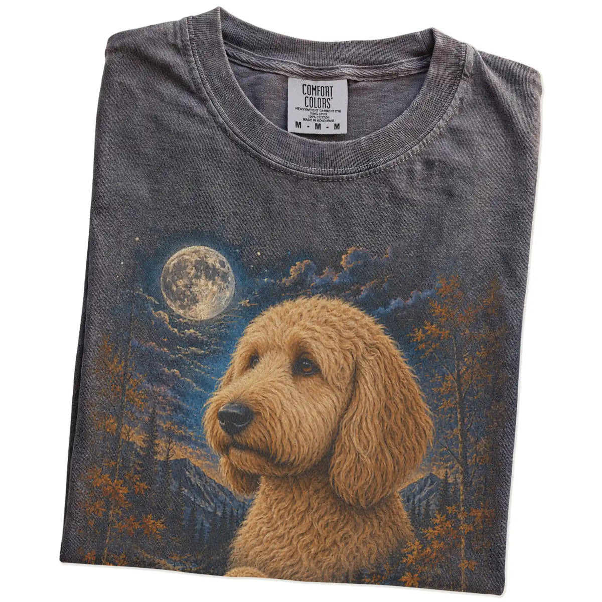 Folded pepper T-shirt with Goldendoodle Autumn Moon artwork.