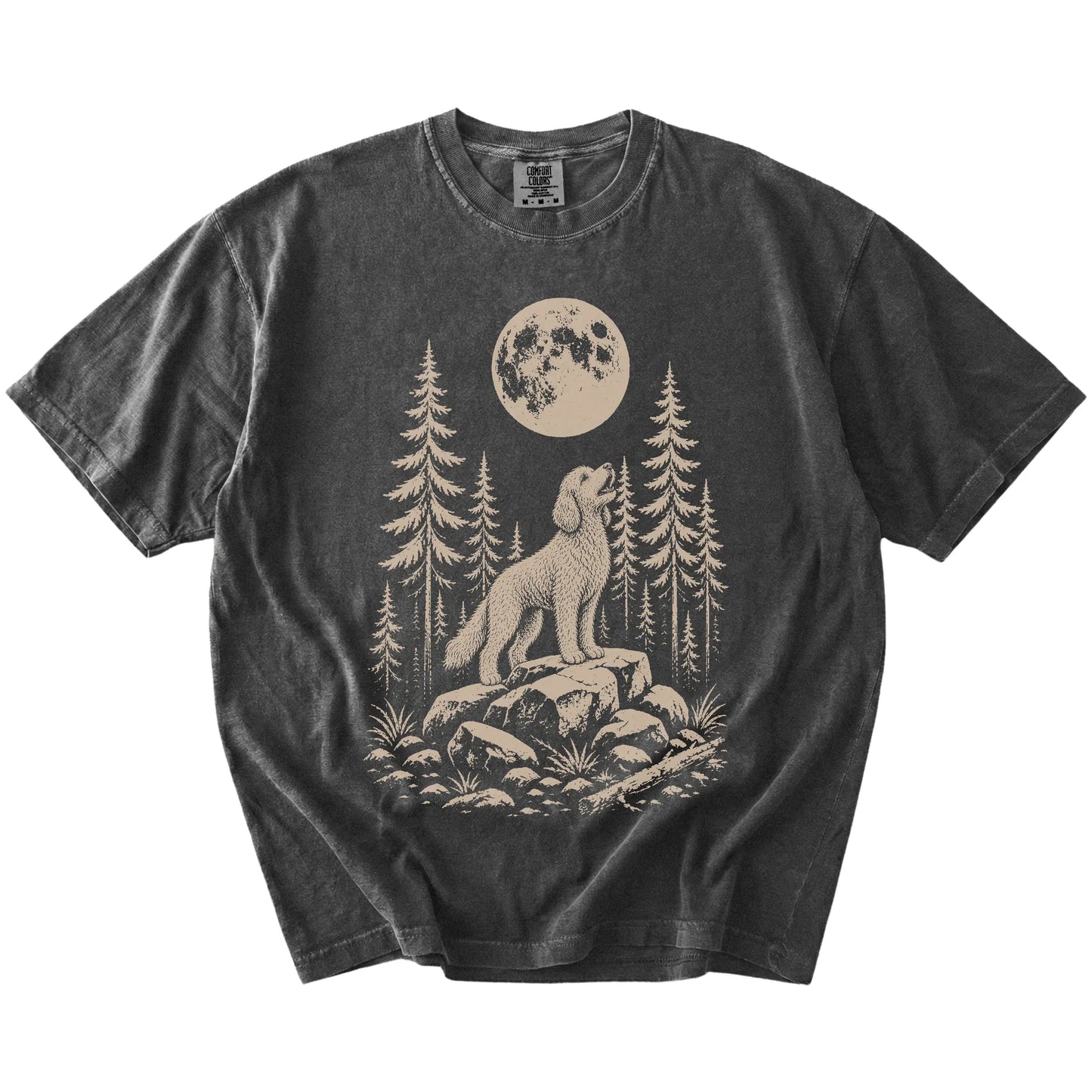 Goldendoodle howling beneath the moon and pine trees on a Pepper Comfort Colors® T-shirt