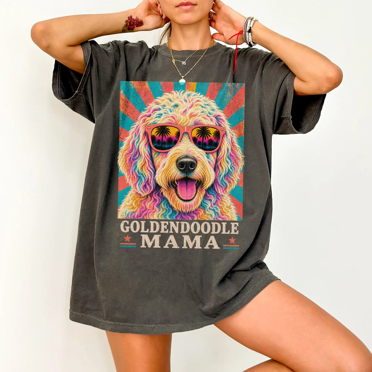 Retro Goldendoodle Mama design on a Pepper Comfort Colors T-shirt worn by a model