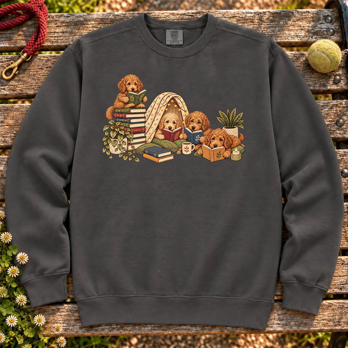 Goldendoodle puppies reading books in a cozy blanket fort on a Pepper sweatshirt