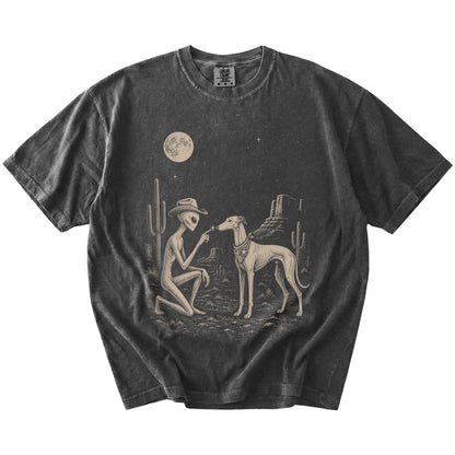 Cowboy alien fist-bumping a Greyhound beneath the moon on a Pepper Comfort Colors® T-shirt