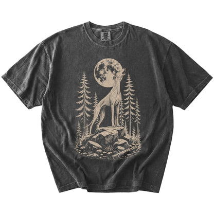 Greyhound howling beneath the moon and pine trees on a Pepper Comfort Colors® T-shirt