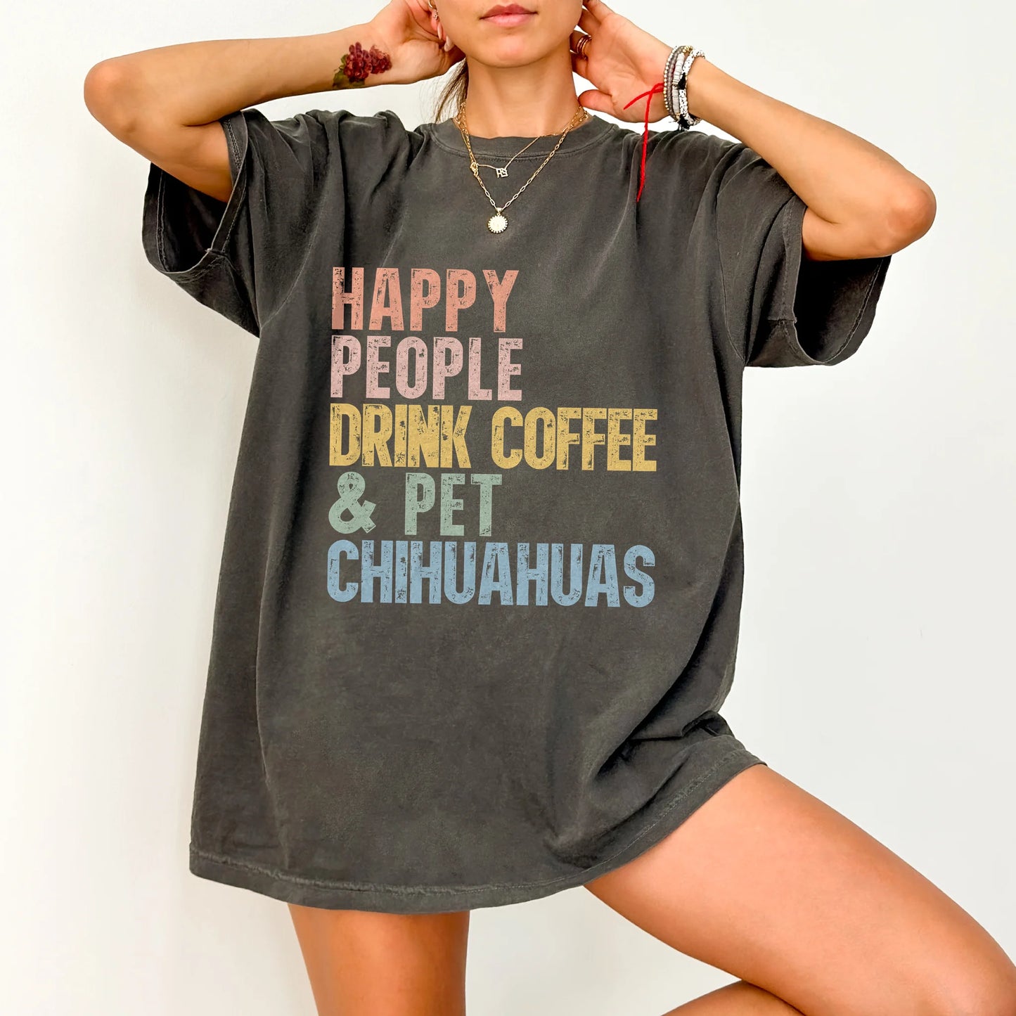 Model wearing a Pepper Comfort Colors® T-shirt featuring Chihuahua with coffee and “Happy People Drink Coffee and Pet Dogs” l