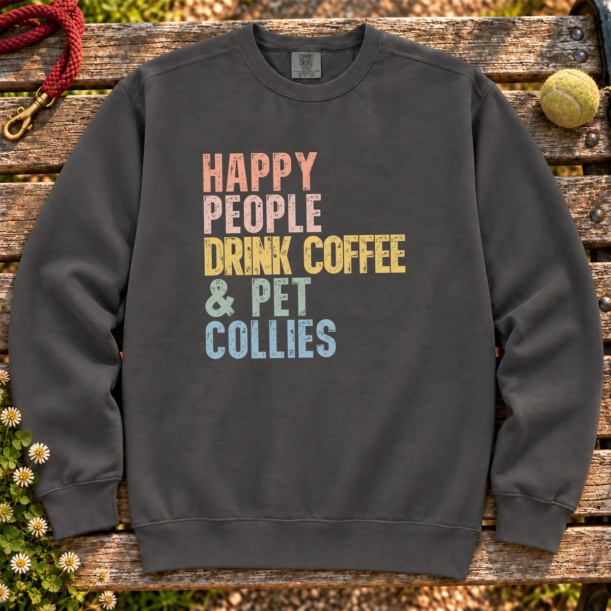 “Happy people drink coffee & pet Collies” text on a Pepper sweatshirt