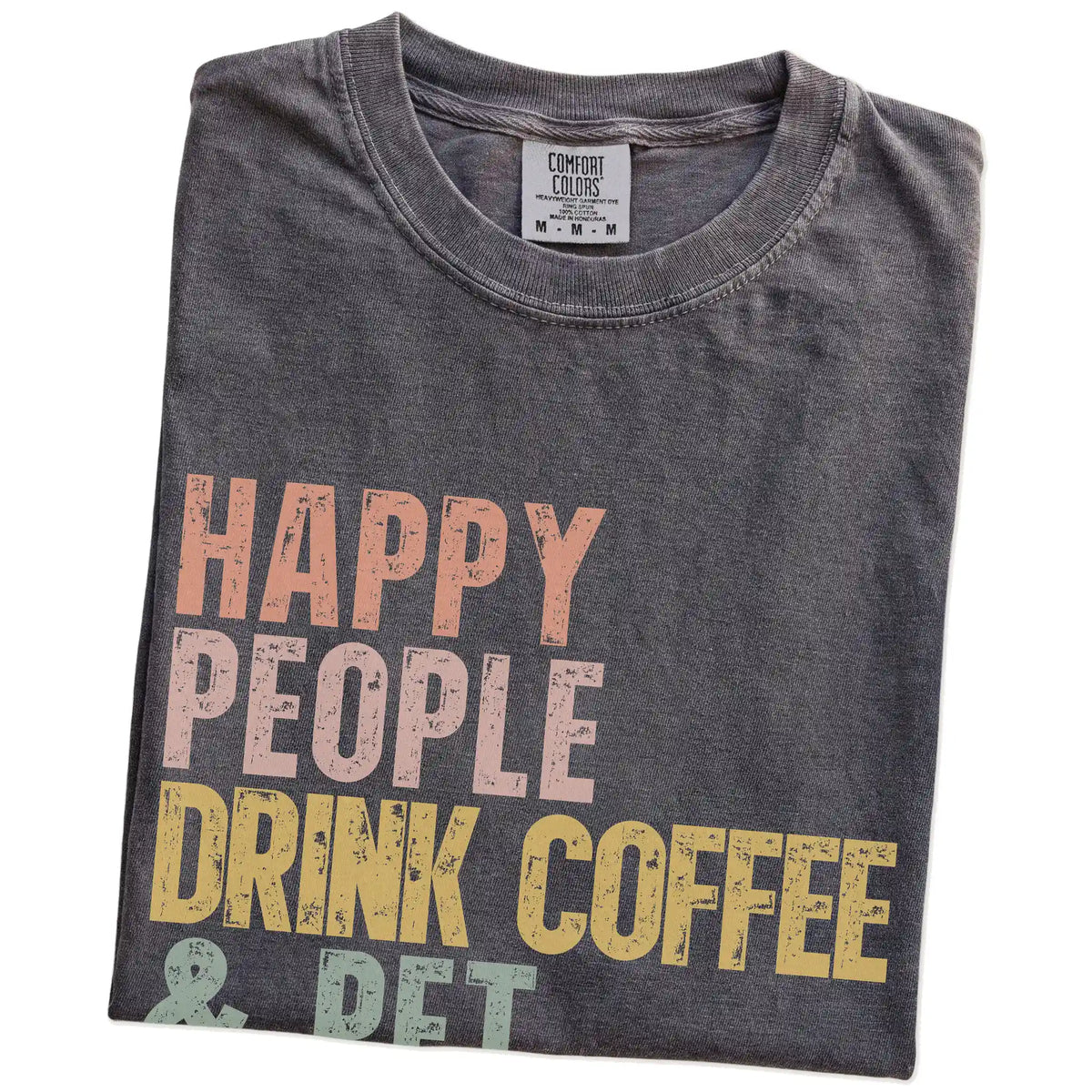 Folded Pepper Comfort Colors® T-shirt showing Doberman with coffee and “Happy People Drink Coffee and Pet Dogs” lettering