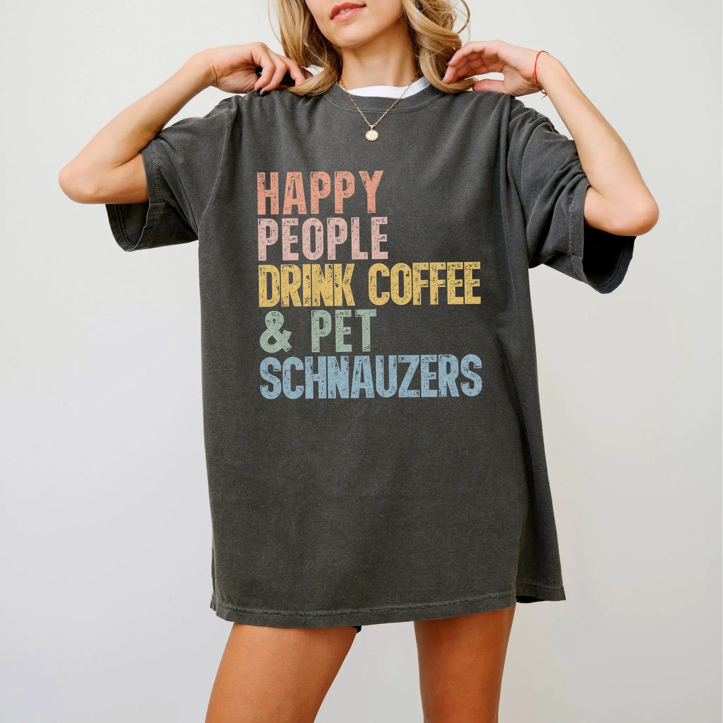 Model wearing a Pepper Comfort Colors® T-shirt featuring Schnauzer with coffee and “Happy People Drink Coffee and Pet Dogs” l