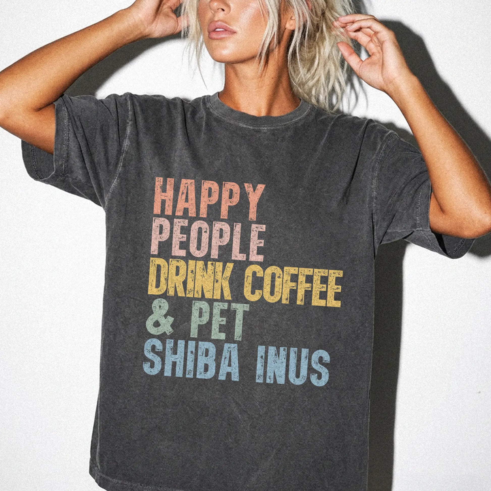 Model wearing a Pepper Comfort Colors® T-shirt featuring Shiba Inu with coffee and “Happy People Drink Coffee and Pet Dogs” l