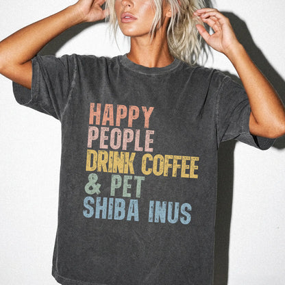Model wearing a Pepper Comfort Colors® T-shirt featuring Shiba Inu with coffee and “Happy People Drink Coffee and Pet Dogs” l