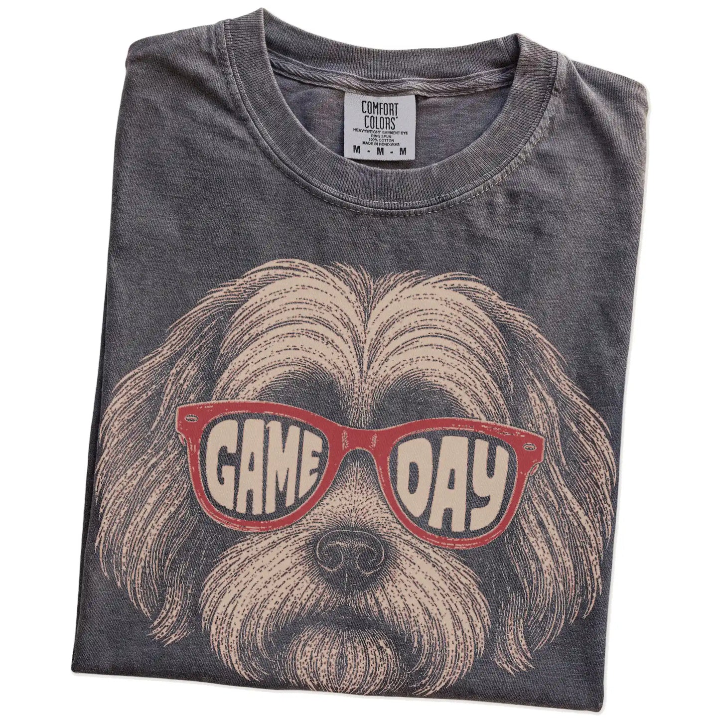 Folded Pepper Comfort Colors® T-shirt showing havanese wearing red game day sunglasses