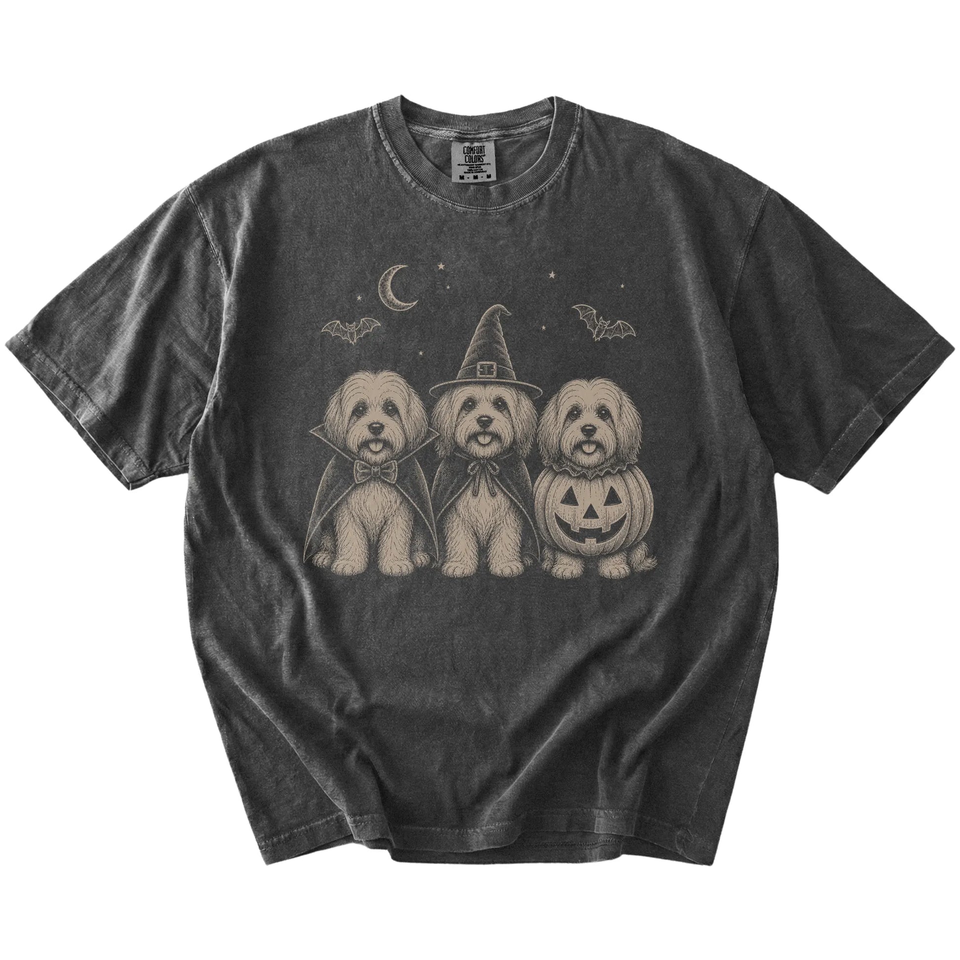 Three Havanese dogs dressed for Halloween beneath bats and a crescent moon on a Pepper Comfort Colors® T-shirt