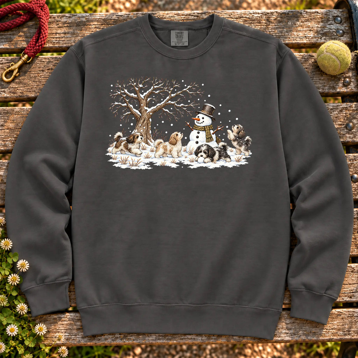 Havanese puppies playing in snow with a snowman on a Pepper sweatshirt