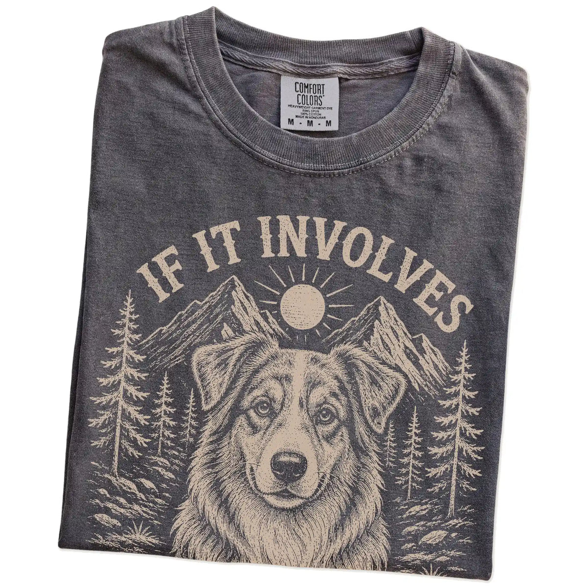 Folded Pepper Comfort Colors® T-shirt showing Australian Shepherd hiking design with mountain scenery