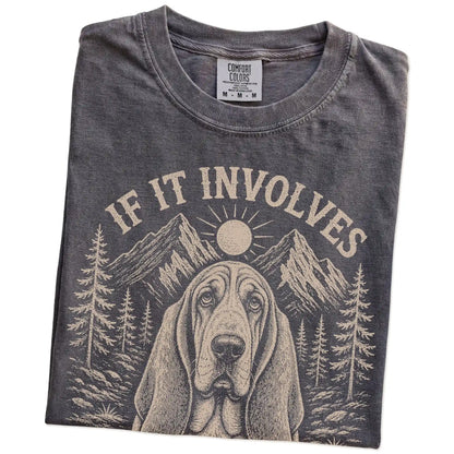 Folded Pepper Comfort Colors® T-shirt showing Basset Hound hiking design with mountain scenery