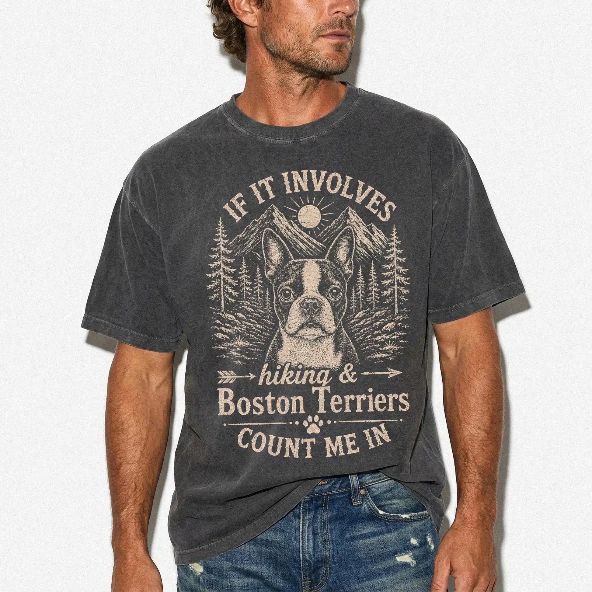 Model wearing a Pepper Comfort Colors® T-shirt featuring Boston Terrier hiking design with mountain scenery