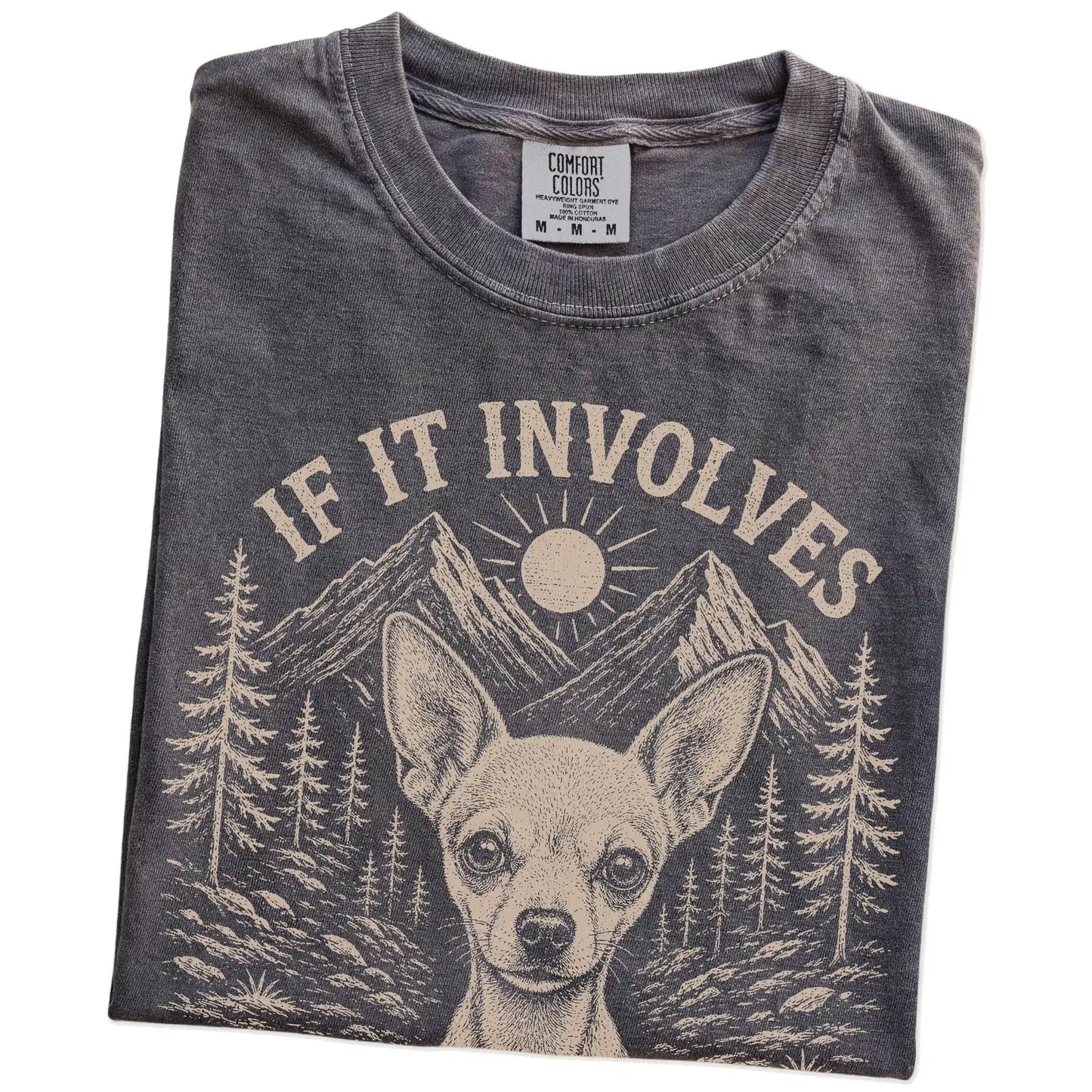 Folded Pepper Comfort Colors® T-shirt showing Chihuahua hiking design with mountain scenery