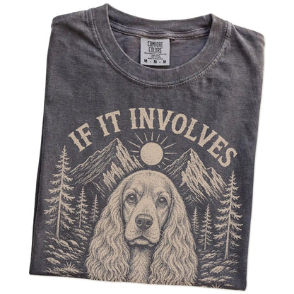 Folded Pepper Comfort Colors® T-shirt showing Cocker Spaniel hiking design with mountain scenery