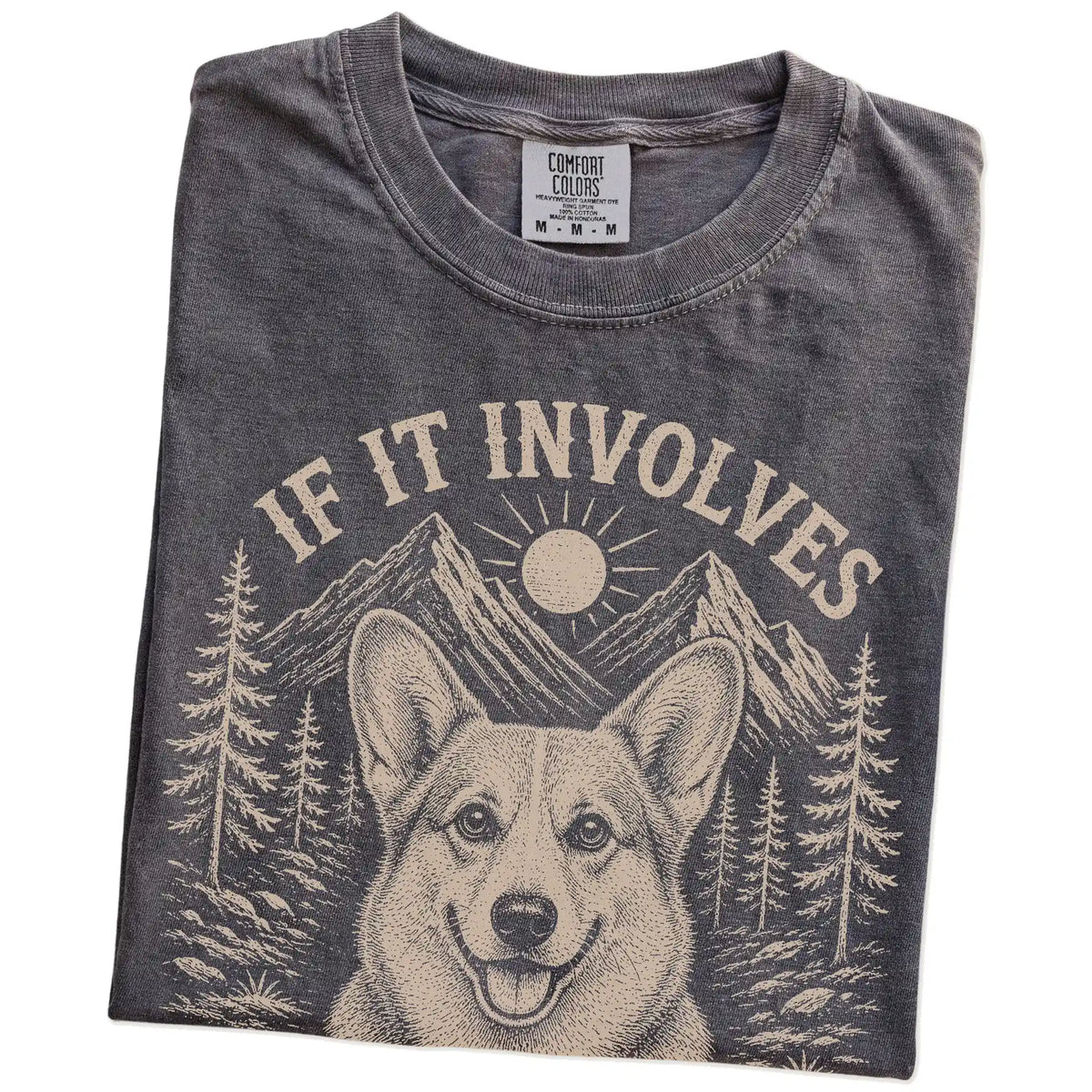 Folded Pepper Comfort Colors® T-shirt showing Corgi hiking design with mountain scenery