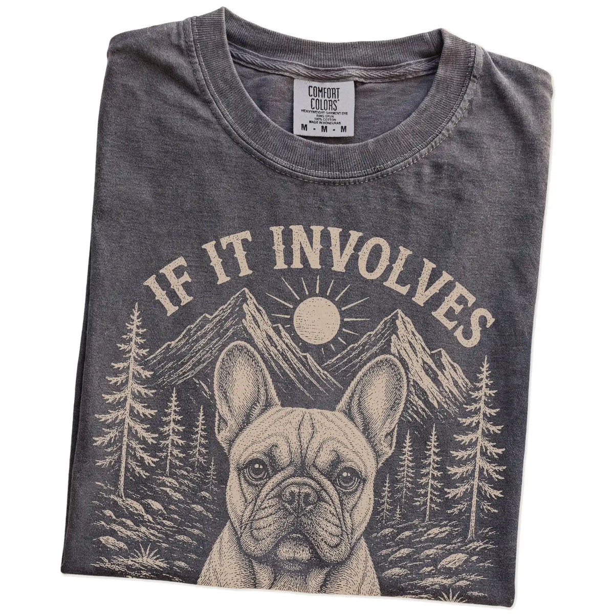 Folded Pepper Comfort Colors® T-shirt showing French Bulldog hiking design with mountain scenery