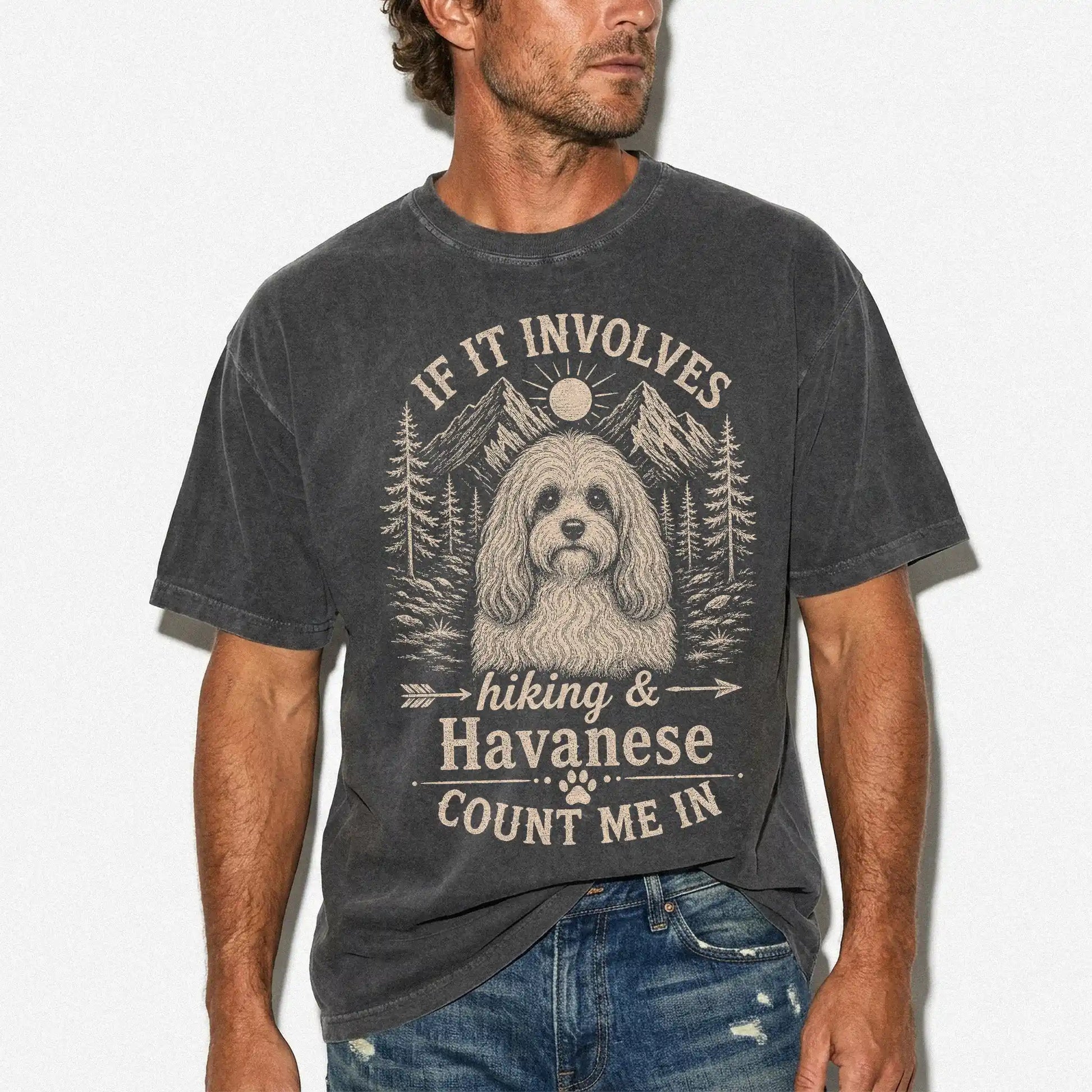 Model wearing a Pepper Comfort Colors® T-shirt featuring Havanese hiking design with mountain scenery
