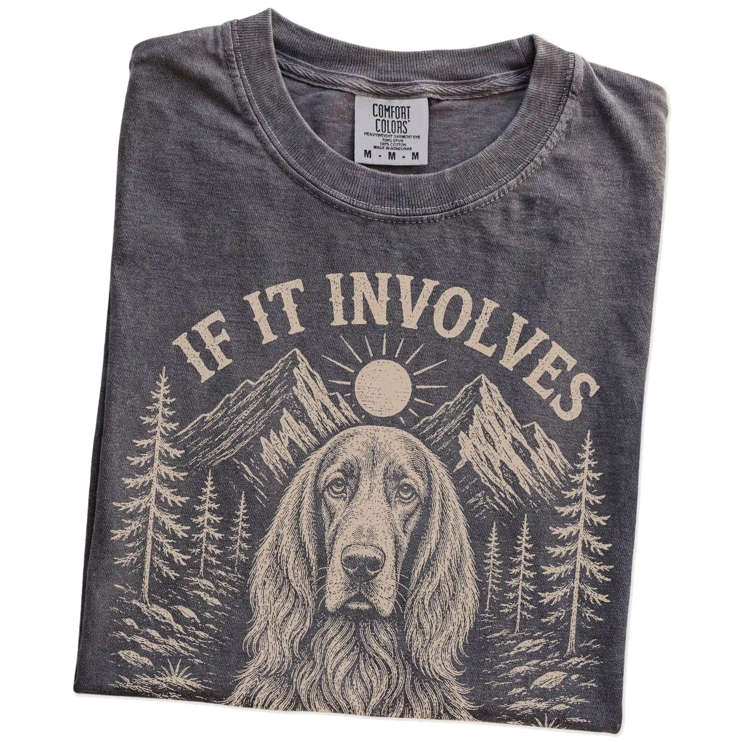 Folded Pepper Comfort Colors® T-shirt showing Irish Setter hiking design with mountain scenery