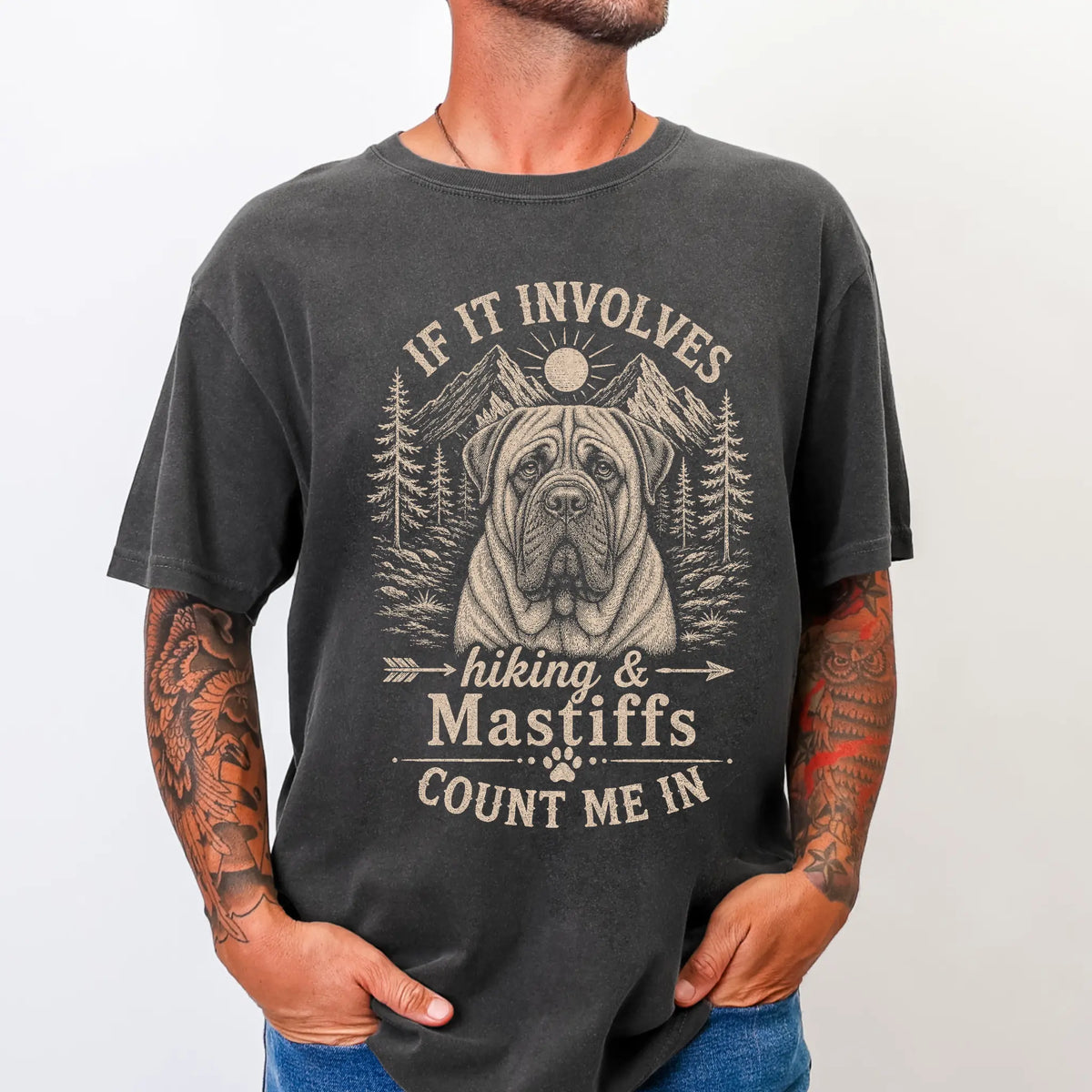 Model wearing a Pepper Comfort Colors® T-shirt featuring Mastiff hiking design with mountain scenery