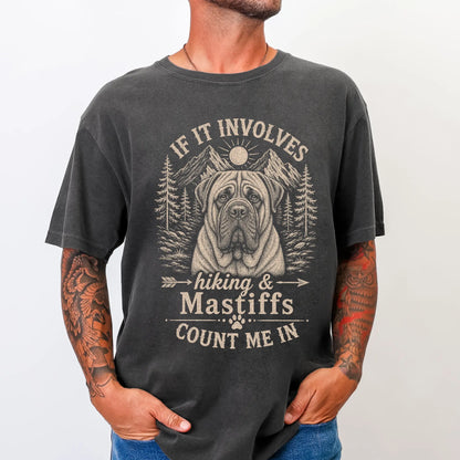 Model wearing a Pepper Comfort Colors® T-shirt featuring Mastiff hiking design with mountain scenery