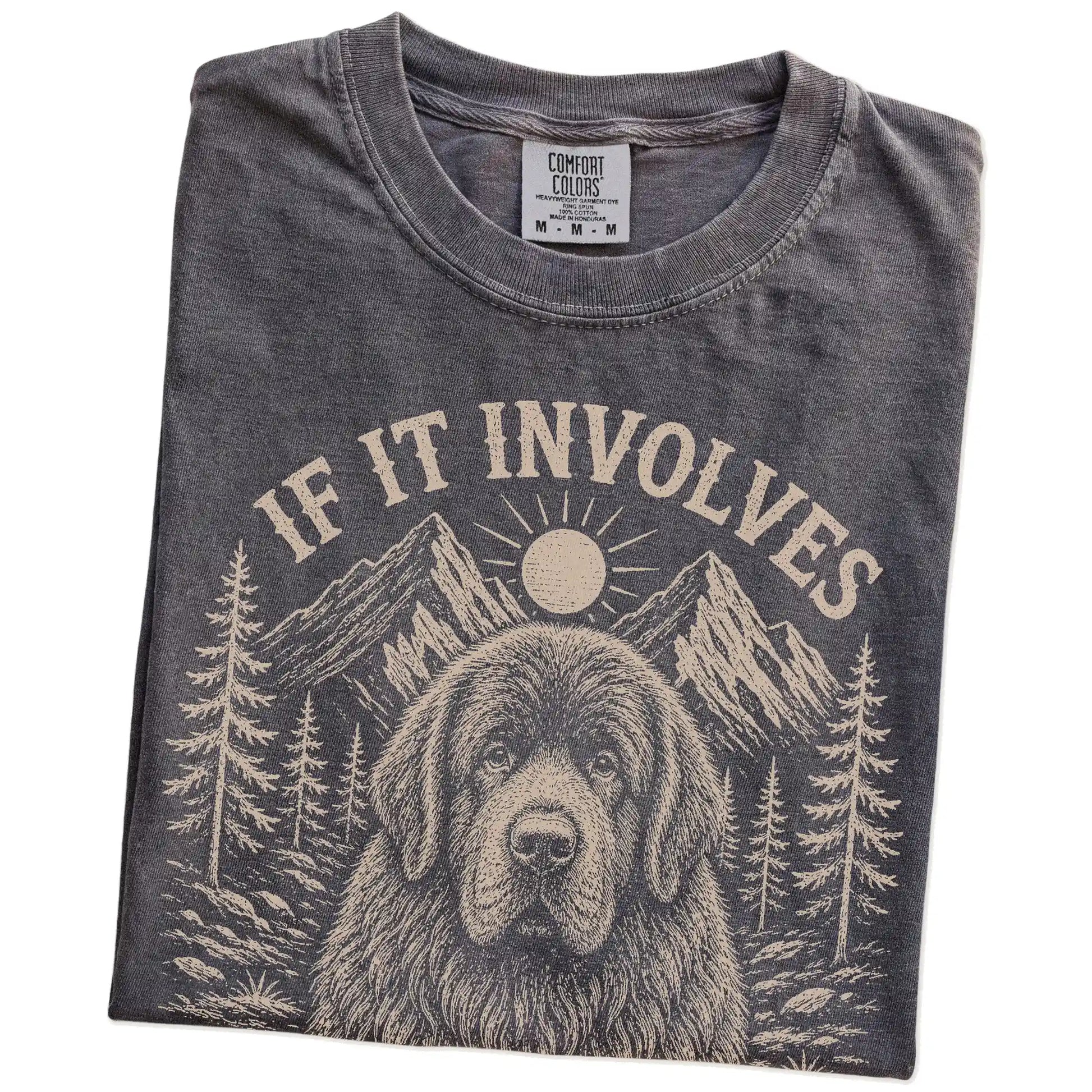 Folded Pepper Comfort Colors® T-shirt showing Newfie hiking design with mountain scenery
