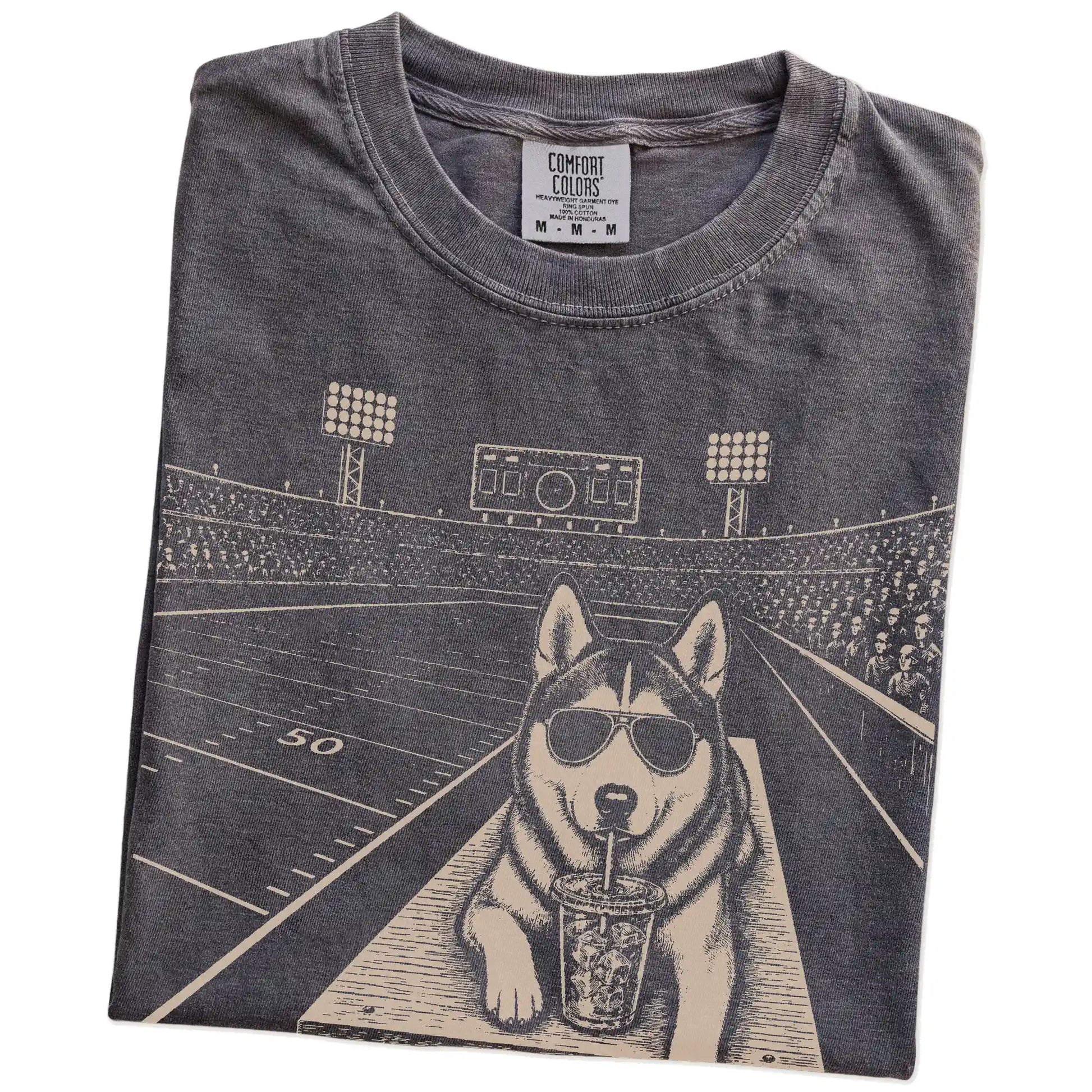 Folded Pepper Comfort Colors® T-shirt showing Husky ready for football and tailgate season
