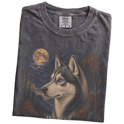 Folded Pepper Comfort Colors® t-shirt showing Husky in a fall forest graphic