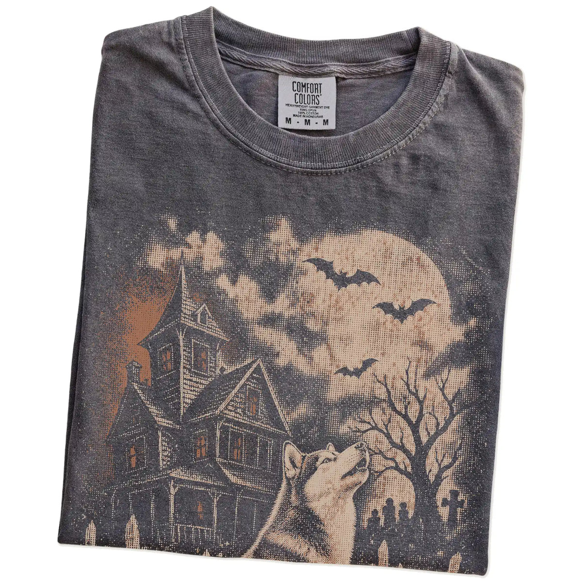 Folded Pepper Comfort Colors® T-shirt showing Husky in a vintage haunted-house scene