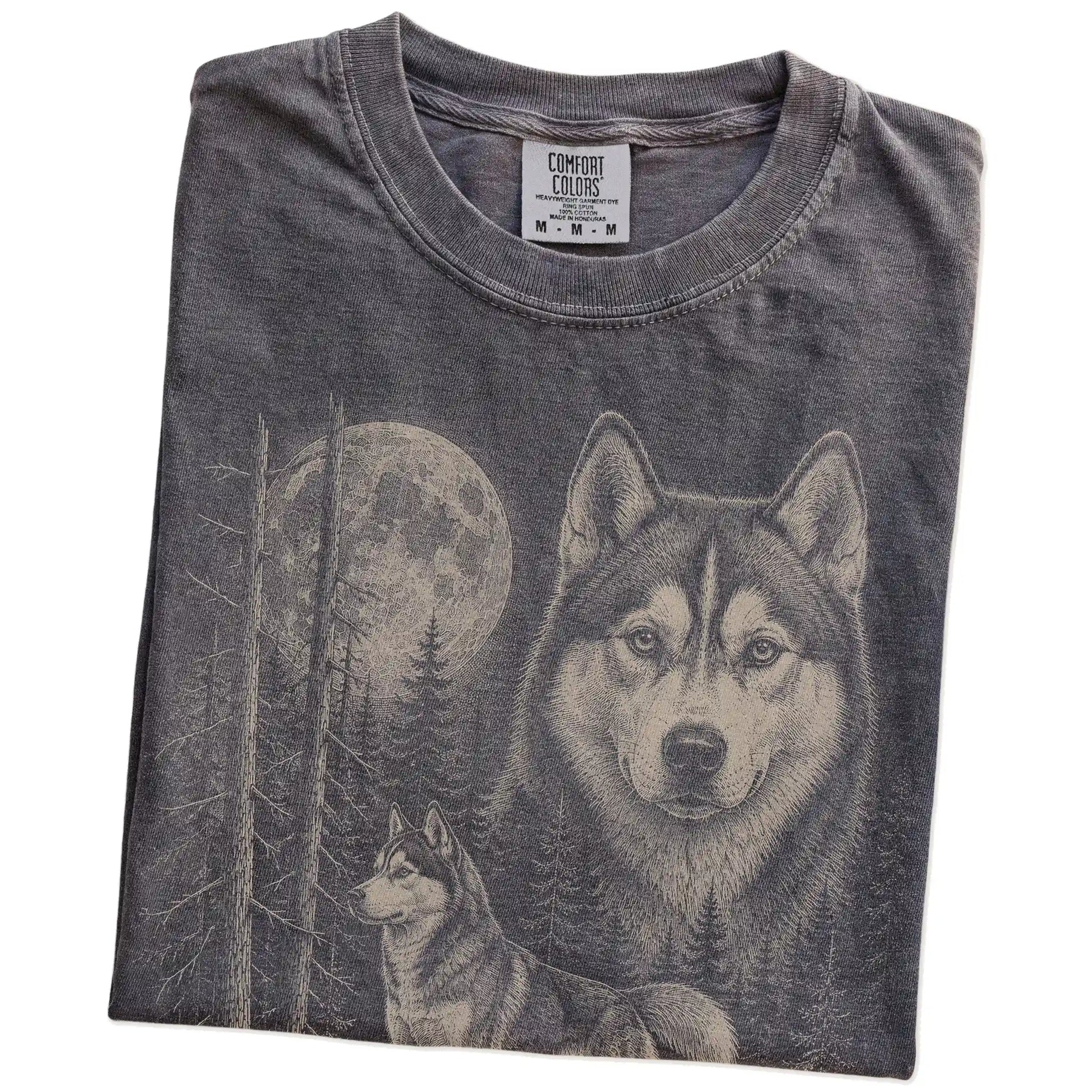 Folded Pepper Husky Moonlit Forest T-Shirt showing the graphic