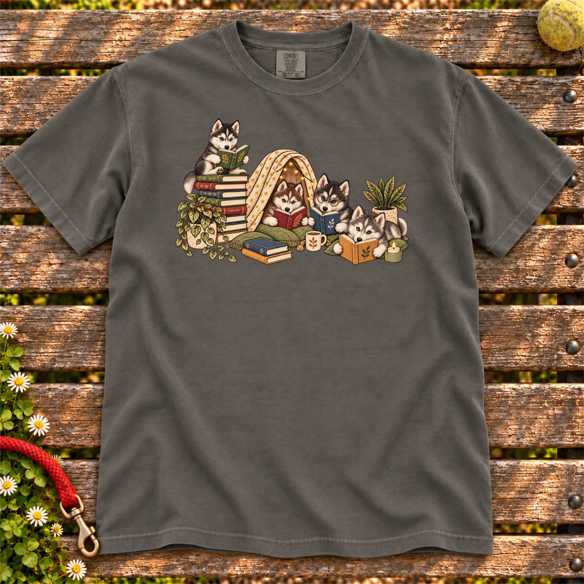 Husky puppies reading books in a cozy blanket fort on a Pepper T-shirt