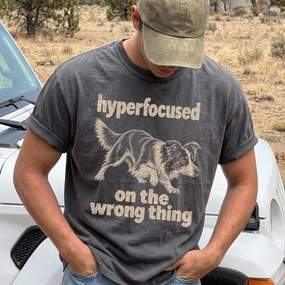 Person wearing a Pepper T-shirt with Border Collie “hyperfocused on the wrong thing” design