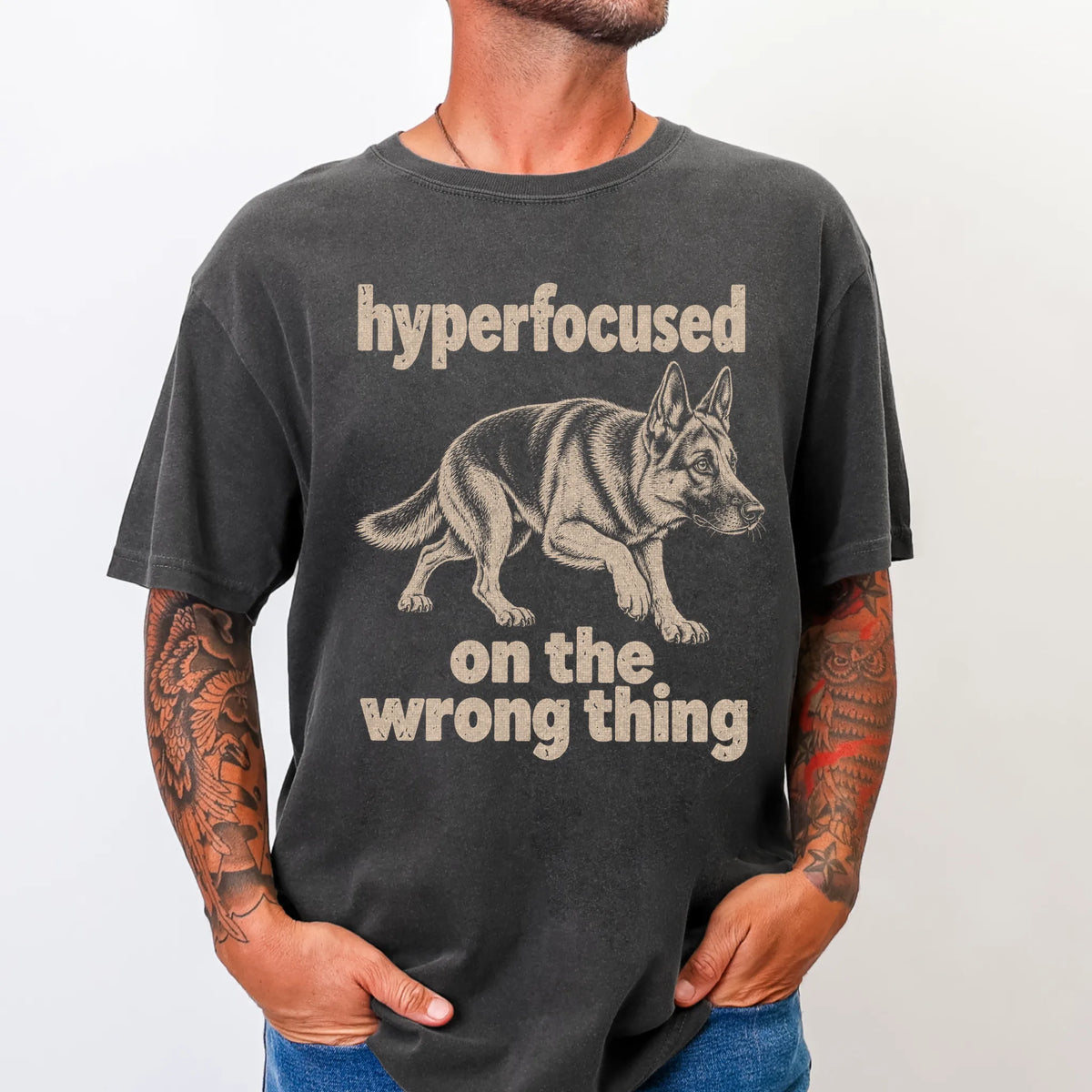 Person wearing a Pepper T-shirt with German Shepherd “hyperfocused on the wrong thing” design