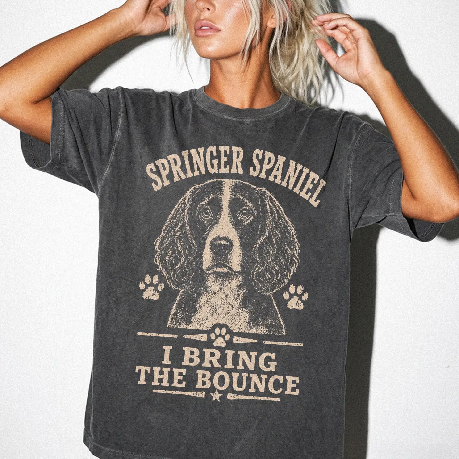 Model wearing a Pepper Comfort Colors® T-shirt featuring Springer Spaniel design with “I Bring The Bounce” lettering