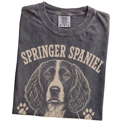 Folded Pepper Comfort Colors® T-shirt showing Springer Spaniel design with “I Bring The Bounce” lettering