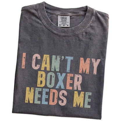 Folded Pepper Comfort Colors® T-shirt showing Boxer with “I Can’t, My Dog Needs Me” lettering