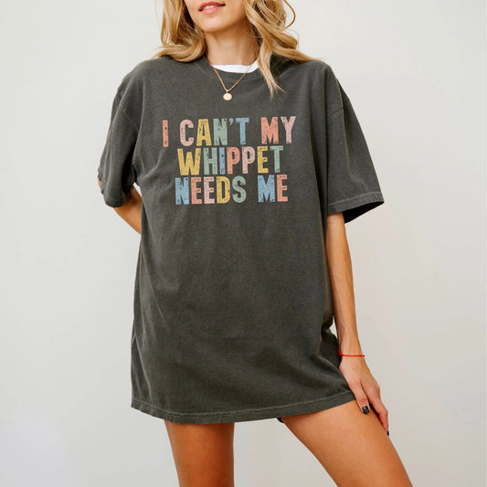 Model wearing a Pepper Comfort Colors® T-shirt featuring Whippet with “I Can’t, My Dog Needs Me” lettering