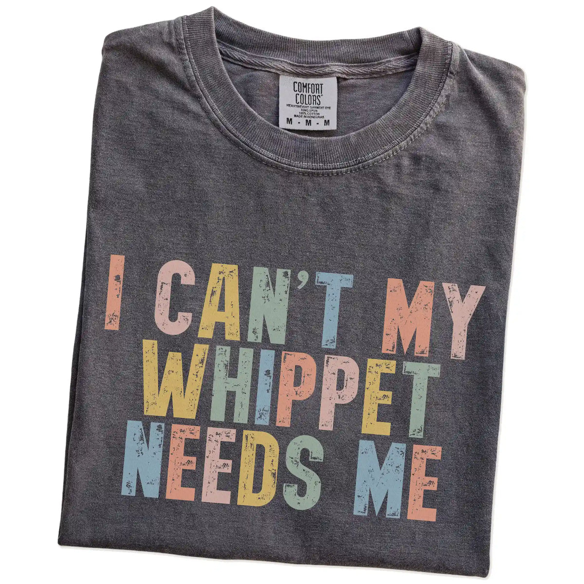 Folded Pepper Comfort Colors® T-shirt showing Whippet with “I Can’t, My Dog Needs Me” lettering